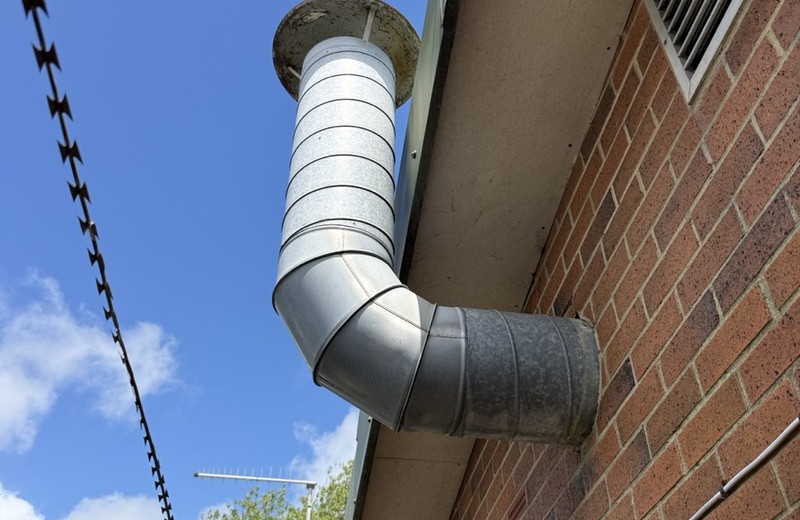 Rooftop kitchen extract fan and ductwork in Heywood